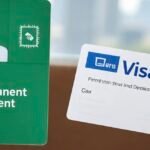 U.S. green card and visa documents placed side by side on passport