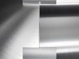 Person polishing stainless steel with microfiber cloth to achieve shine