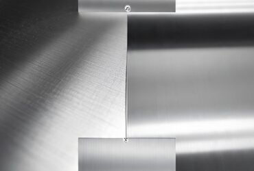 Person polishing stainless steel with microfiber cloth to achieve shine